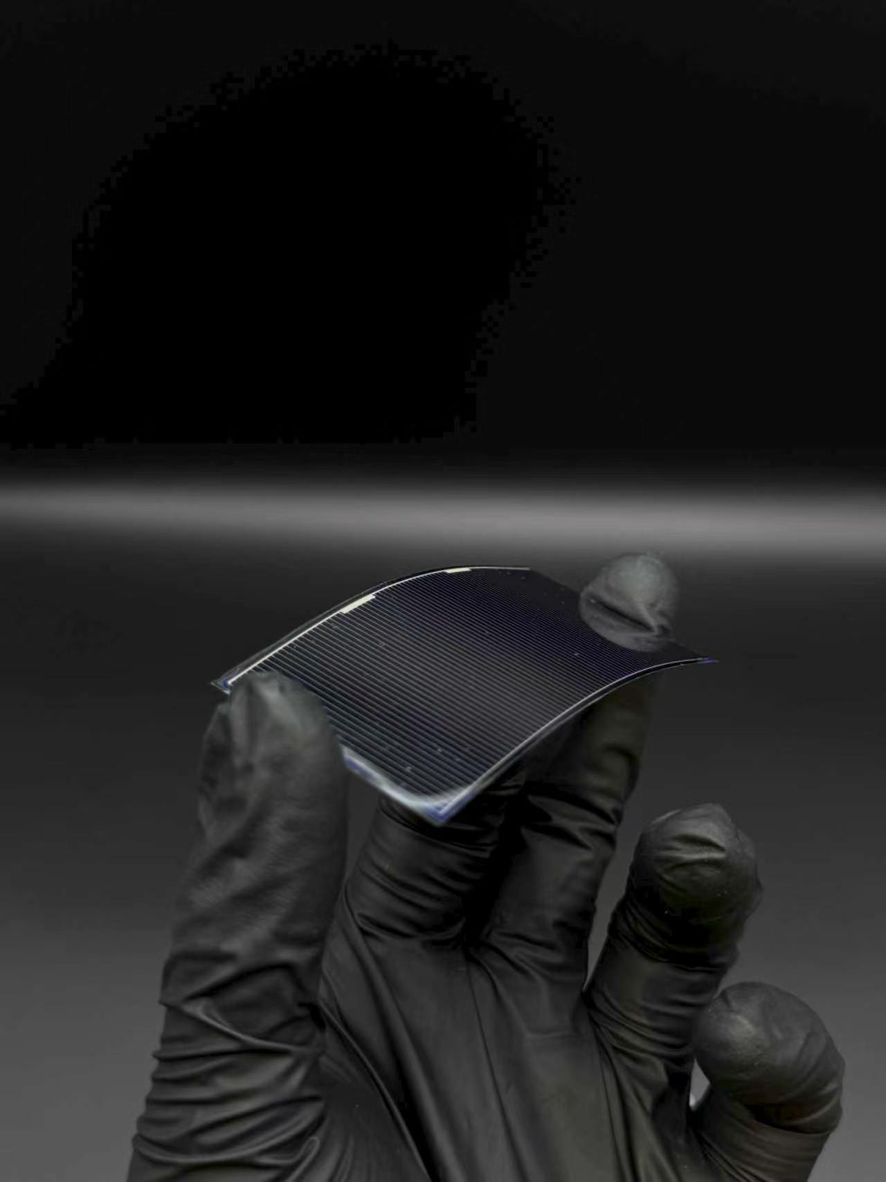 Side view of HJT flexible solar cell sample under bend